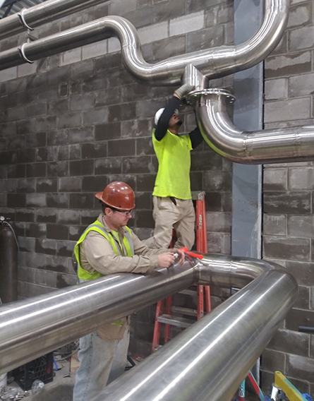 Men Repairing Pipes